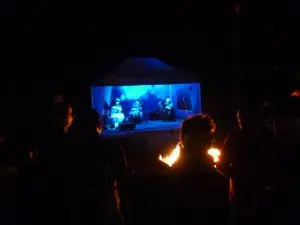 The acoustic band playing at night.